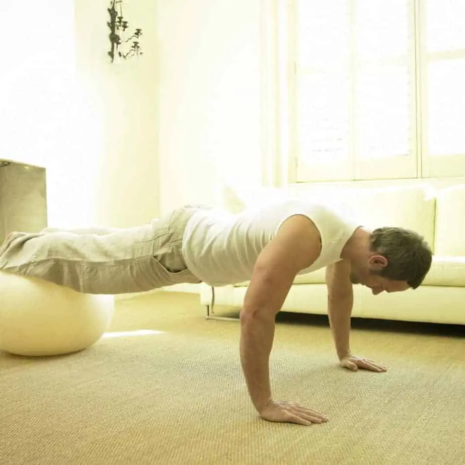 man doing decline push-ups; bodyweight exercises, bodyweight chest exercises, bodyweight workout, body weight exercises